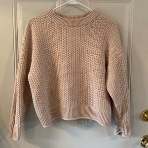 Cream colored knit sweater.